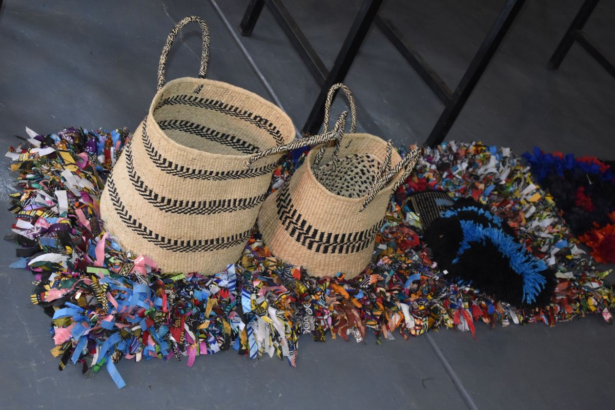 Handwoven mats and baskets made by a RYCP artisan