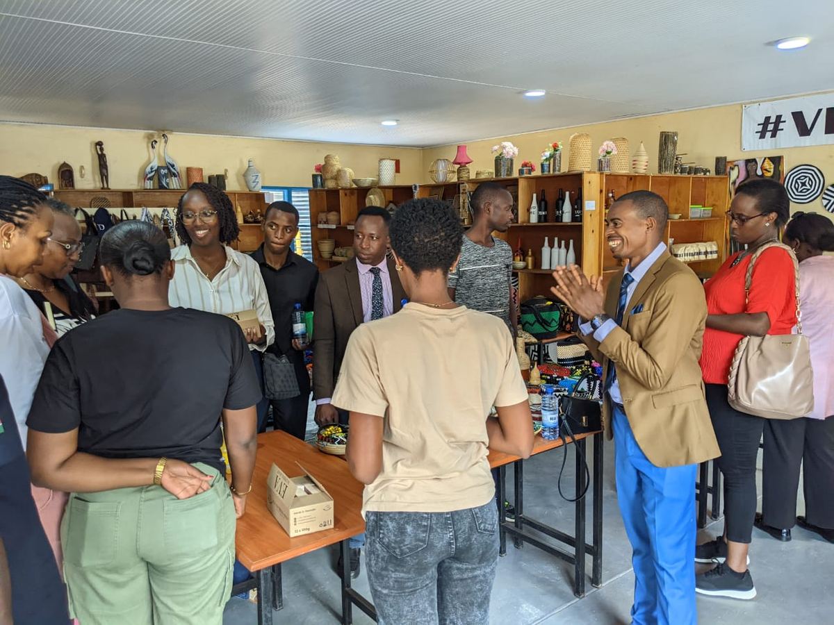 Visitors touring a showroom of RYCP handicraft products
